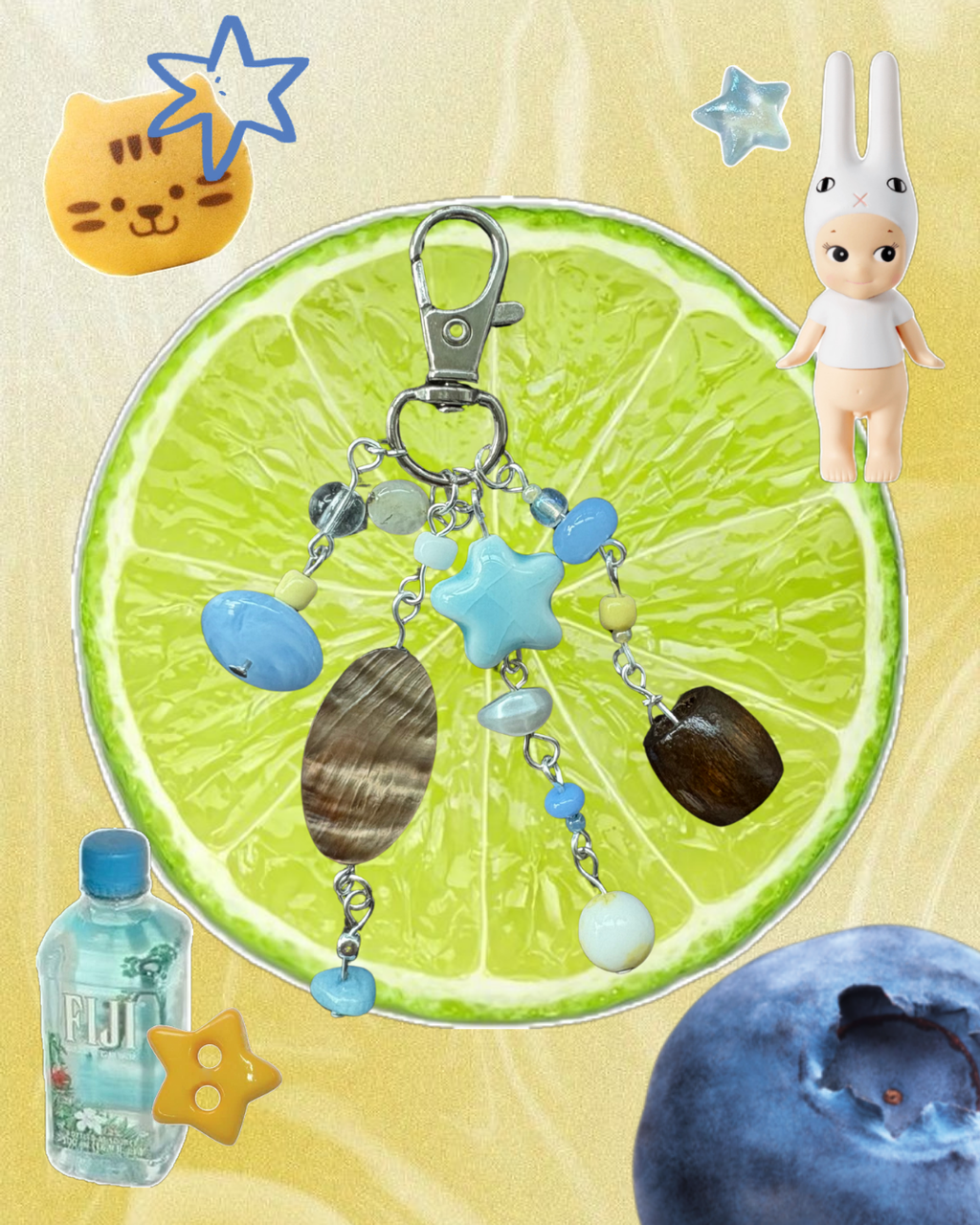 Keychain with star and shell charms on a lime slice background